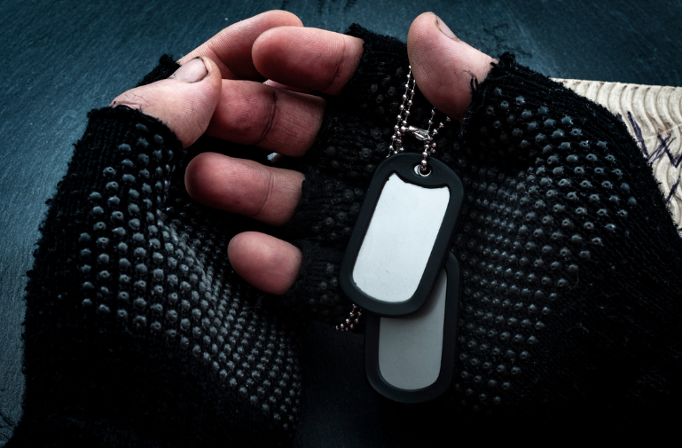 Homeless vet holding dogtags